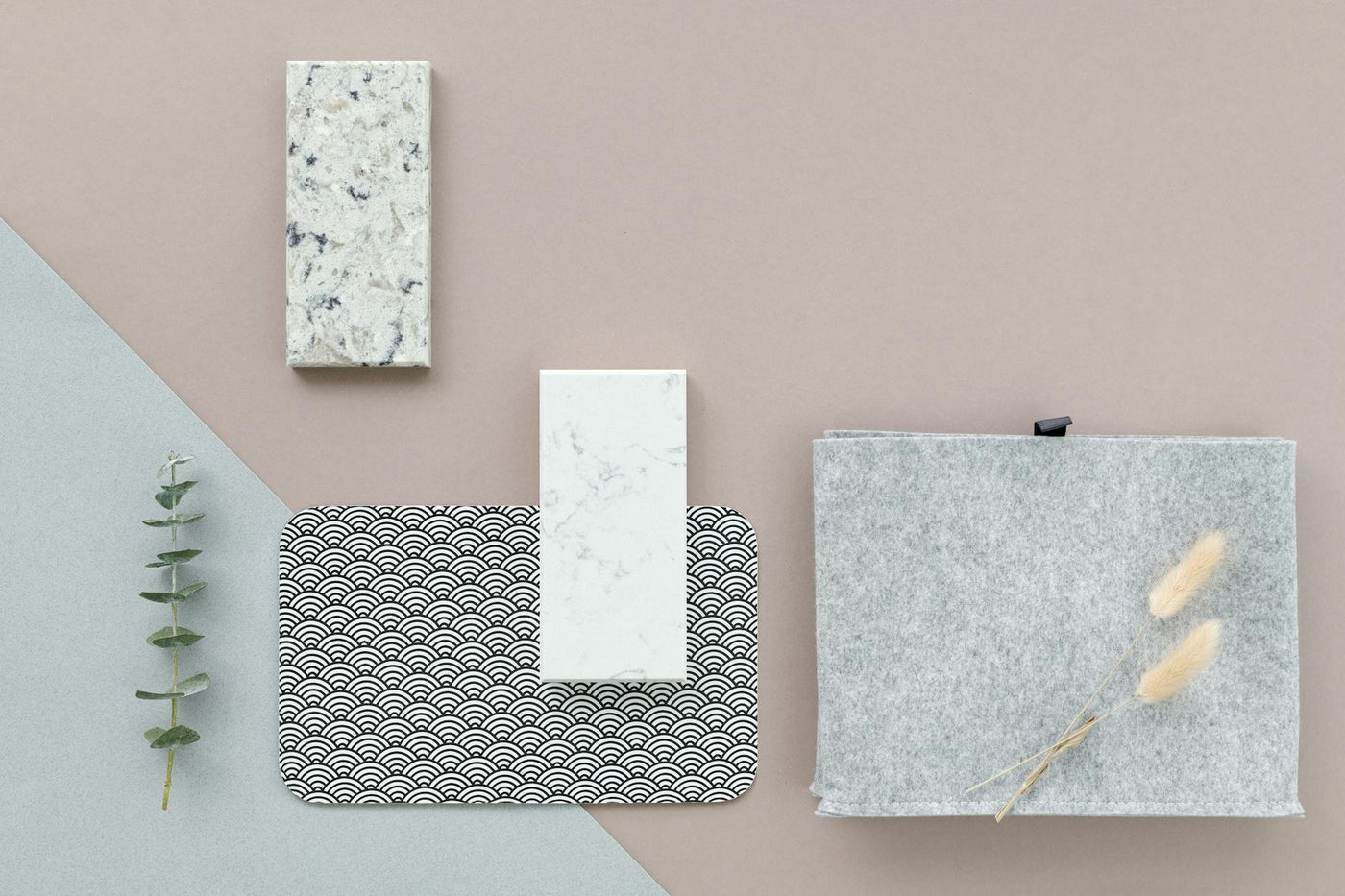 Flat lay of tiles and textures showcasing minimalist materials and patterns.